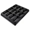 Empty black roll platter with twelve individual oblong recesses