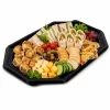 Black octagonal platter base filled with wraps, pastries, cheese and vegetables
