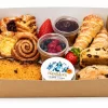 Small brown kraft platter tray filled with pastries and portion pots