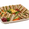 Large square natural pulp platter filled with sandwiches