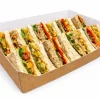 Kraft cut-front platter tray with a white interior and filled sandwiches